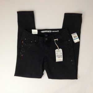 Indigo United Studded Pocket Skinny Ankle Jeans.